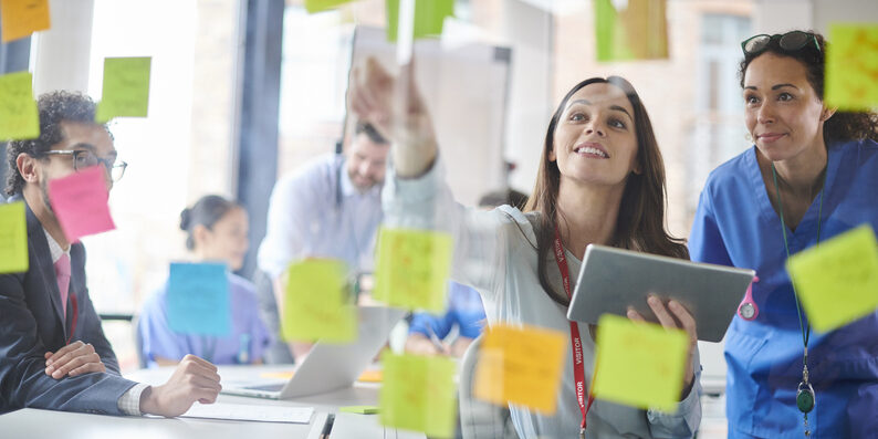 medical team brainstorming with administrator